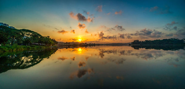 Scenic view of lake against sky during sunset