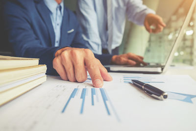 Close-up of man working on table