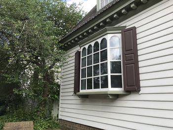 Low angle view of house window on building