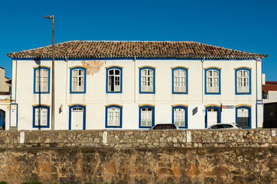 Low angle view of building against clear blue sky