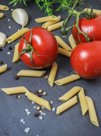 Close-up of tomatoes and vegetables on table