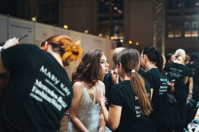 Group of people at music concert in city