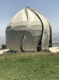 Built structure on field against clear sky