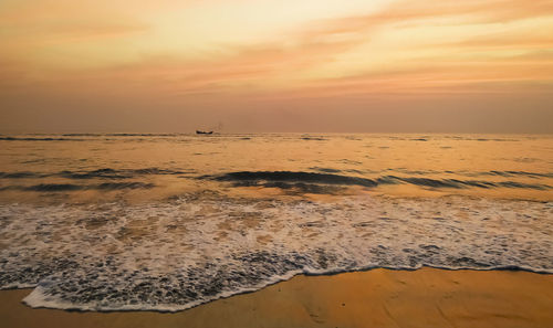 Scenic view of beach against sky during sunset