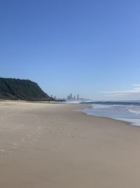 Scenic view of beach against clear sky