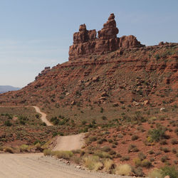 Rock formations on landscape against sky