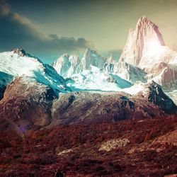 Panoramic view of snowcapped mountains against sky