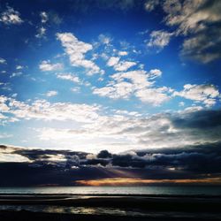 Scenic view of sea against dramatic sky