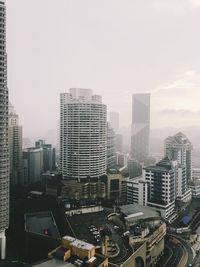 High angle view of buildings in city against sky