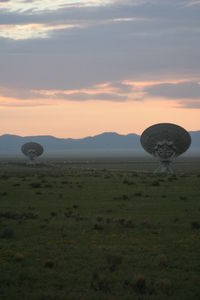 Scenic view of field against sky during sunset