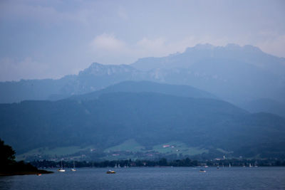 Scenic view of lake against sky at dusk