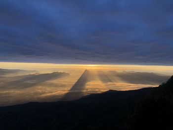 Scenic view of silhouette mountain against sky during sunset