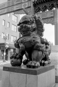 Low angle view of statue against building