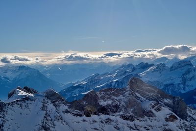 Scenic view of snowcapped mountains against sky