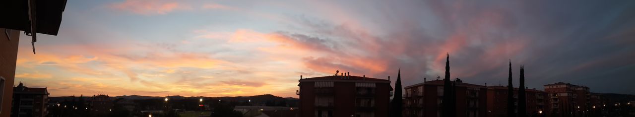 Panoramic view of city against dramatic sky