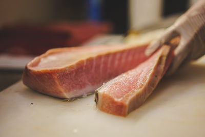 Close-up of fillet tuna on cutting board