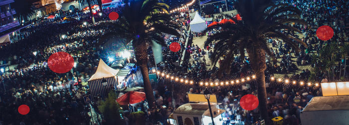 Low angle view of illuminated lanterns hanging at night