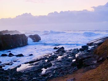 Scenic view of sea against sky during sunset