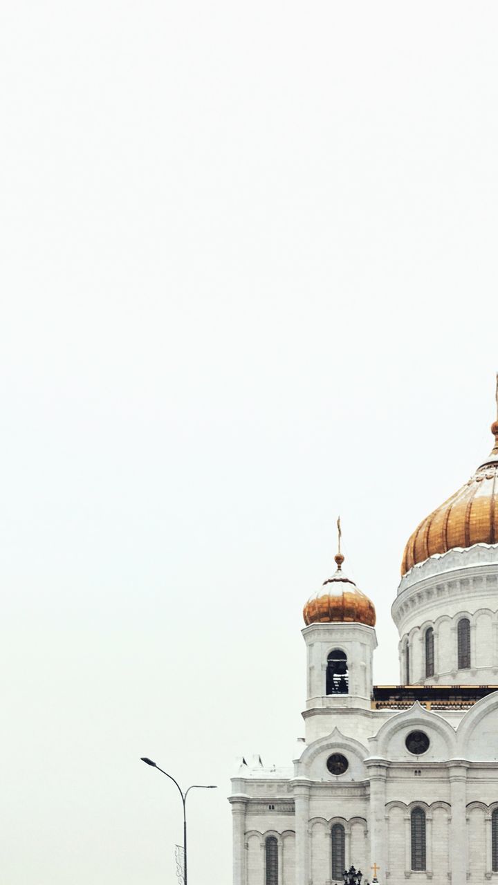LOW ANGLE VIEW OF BUILDINGS AGAINST CLEAR SKY