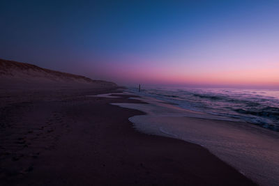 Scenic view of sea against sky at sunset