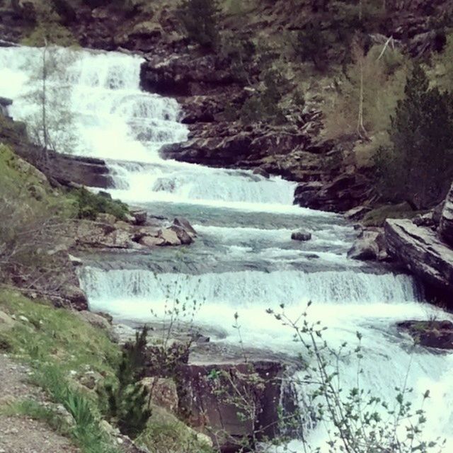 SCENIC VIEW OF RIVER FLOWING THROUGH ROCKS