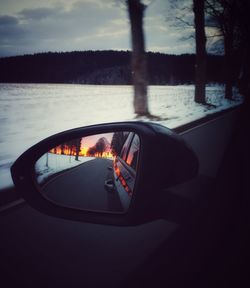 Reflection of car on side-view mirror