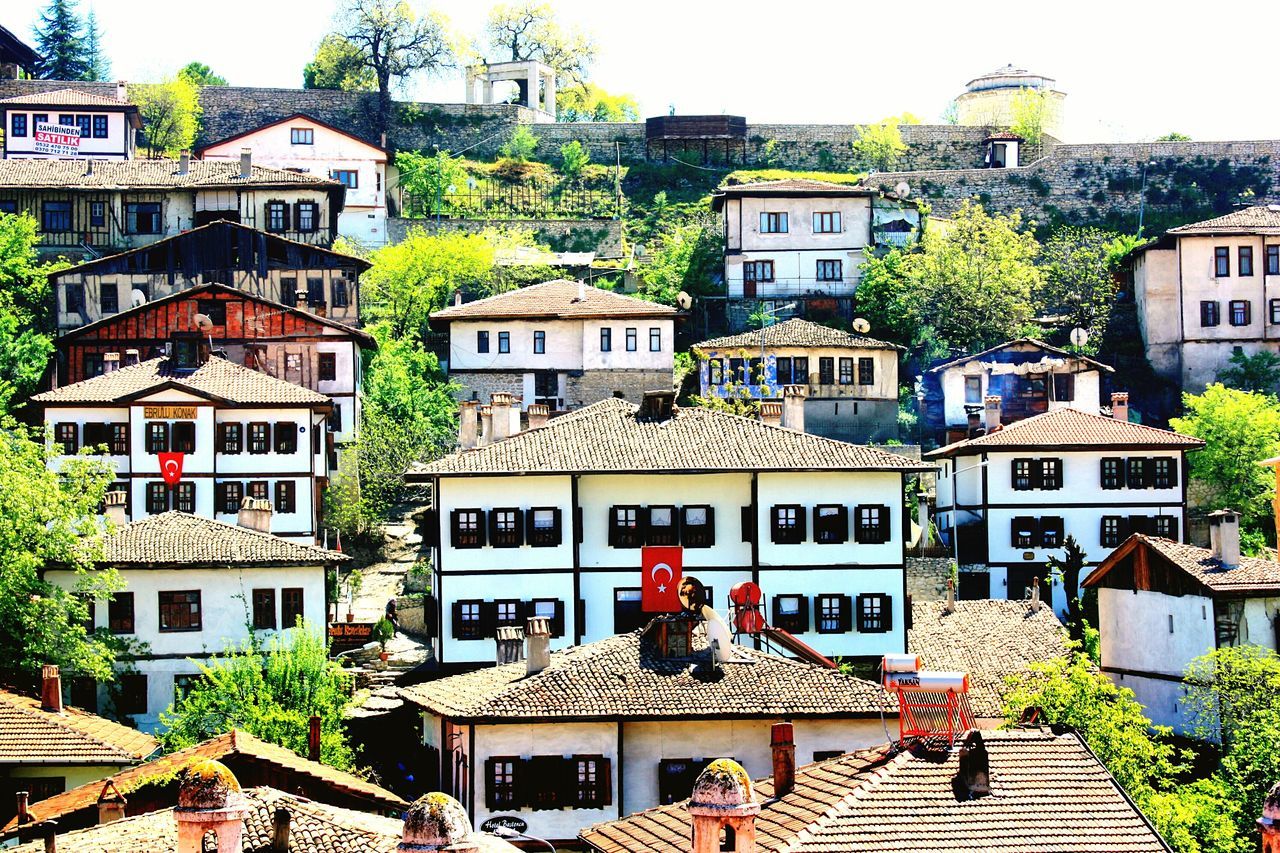 building exterior, architecture, built structure, residential building, residential structure, house, roof, tree, residential district, town, window, balcony, old town, sky, day, roof tile, building, city, outdoors, facade