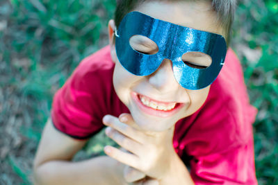 Close-up of smiling boy wearing mask