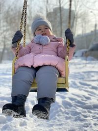 Low angle view of child playing in snow