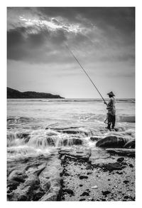 Man fishing in sea