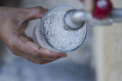 Close-up of hand holding ice cream