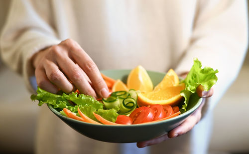 Midsection of man preparing food