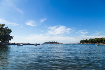 Scenic view of sea against blue sky