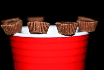 Close-up of cupcakes against black background