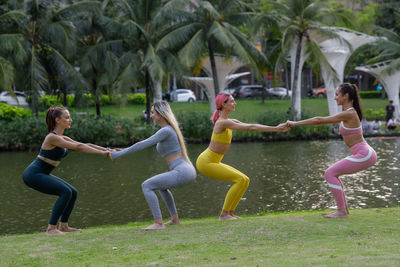 Four pretty young women doing fitness in the park instead of going to the gym. exercise