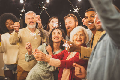 Cheerful people celebrating outdoors