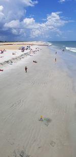 High angle view of people on beach against sky