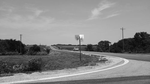 Empty road against sky