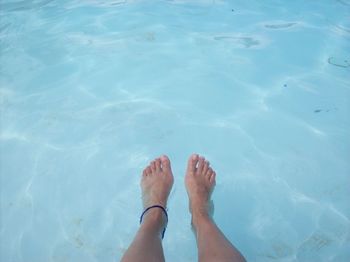 Low section of woman in swimming pool