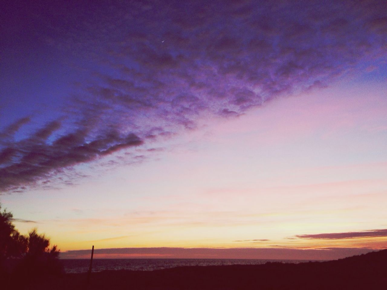 tranquil scene, tranquility, scenics, sunset, beauty in nature, sky, silhouette, nature, idyllic, landscape, cloud - sky, cloud, non-urban scene, orange color, dusk, remote, outdoors, sea, no people, majestic