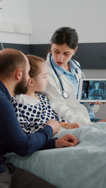 Doctor examining patient in hospital