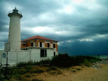 View of old building against cloudy sky