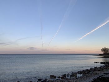 Scenic view of sea against sky at sunset