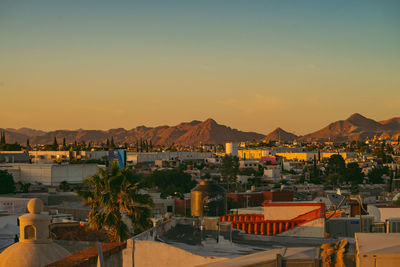 High angle view of townscape against sky at sunset