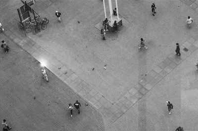 High angle view of people walking on street