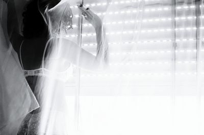 Close-up of illuminated lighting equipment hanging on table