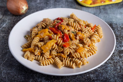 Pasta with peproni, tuna and onion. typical dish of the mediterranean diet