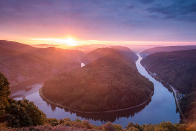 Scenic view of mountains against sky during sunset