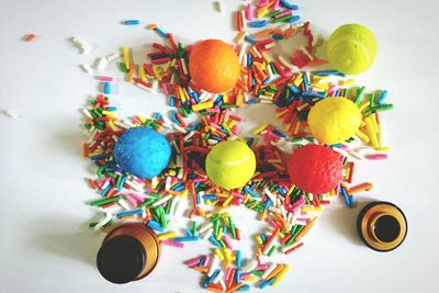 Directly above shot of sweet food and container on white background