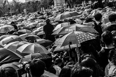 People holding umbrella outdoors